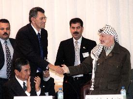 Palestinian, Israeli leaders shake hands at donors meeting
